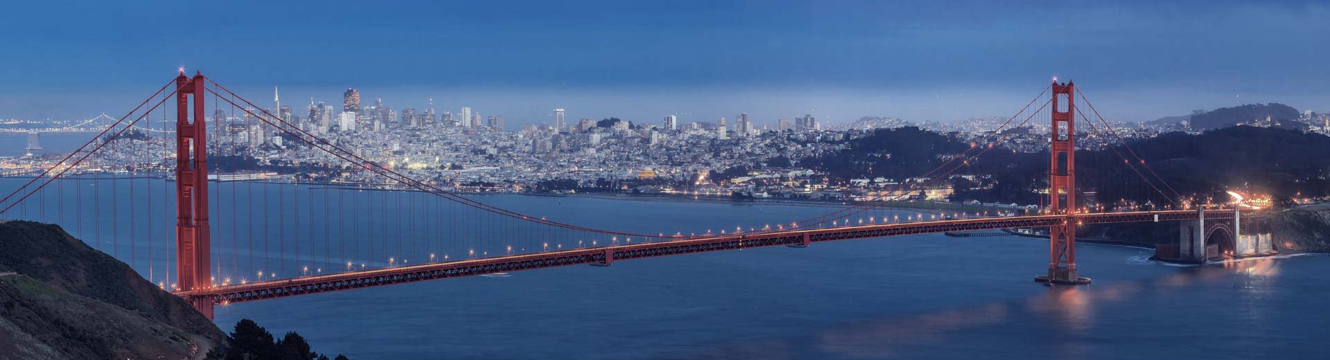 With San Francisco in the background, the world-famous Golden Gate Bridge stretches across the bay.