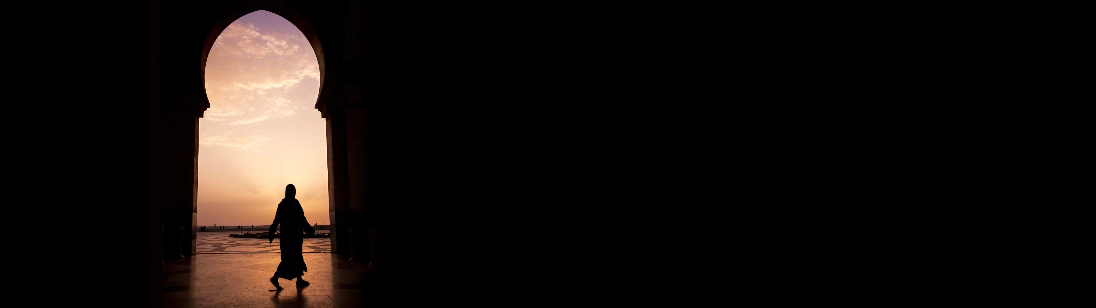 Shot of someone walking in Casablanca against a dawn shadow.