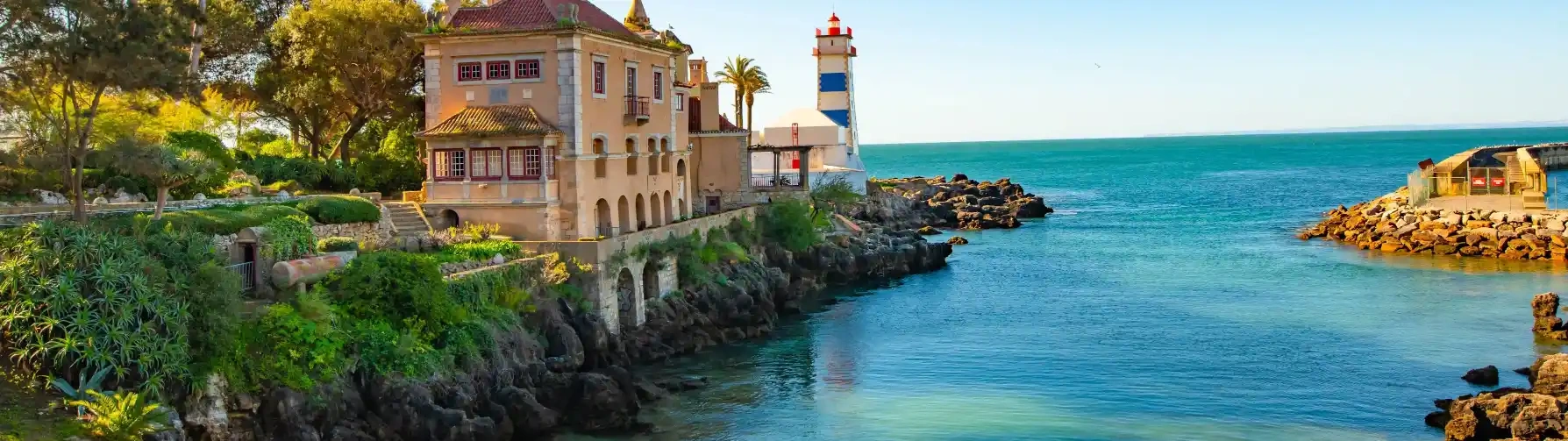 The Santa Marta Lighthouse in Cascais, Portugal, with the sea in the background.