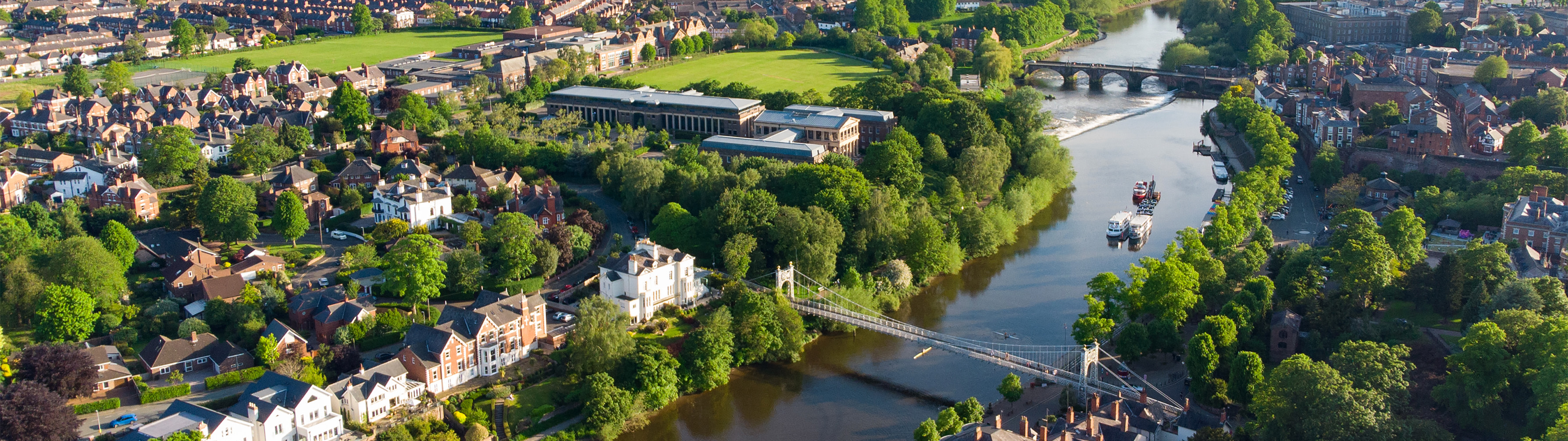 Beautiful town of Chester, an array of greens split down the middle by a dark waterway.