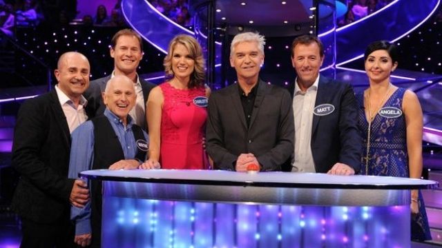 Matt and Angela with fellow contestants and host of Mr & Mrs All Stars, Phillip Schofield (Image Credit: ITV)