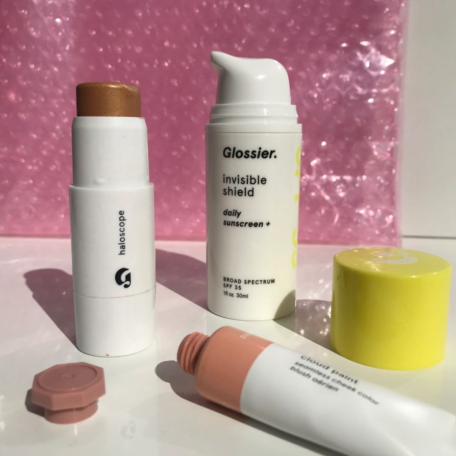Haloscope in Topaz, Invisible Shield, and Cloud Paint in Dusk with a Glossier Pink Pouch.