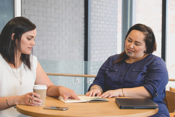 A Maori woman going through her program with her Coach