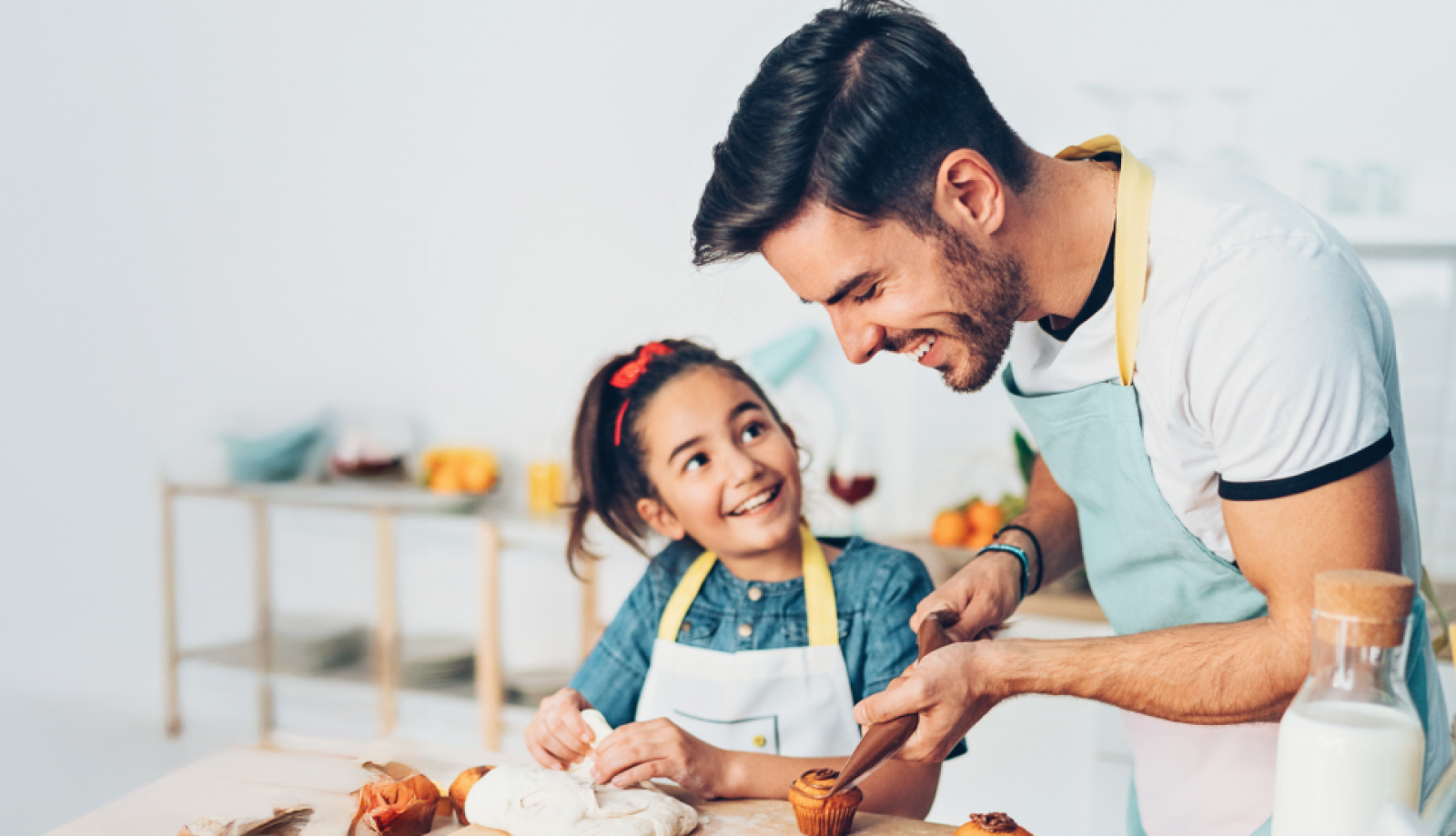Father and daughter baking in the kitchen