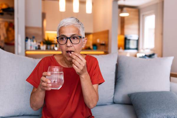 woman taking medication