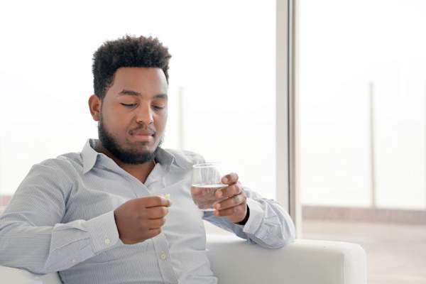 man taking pill