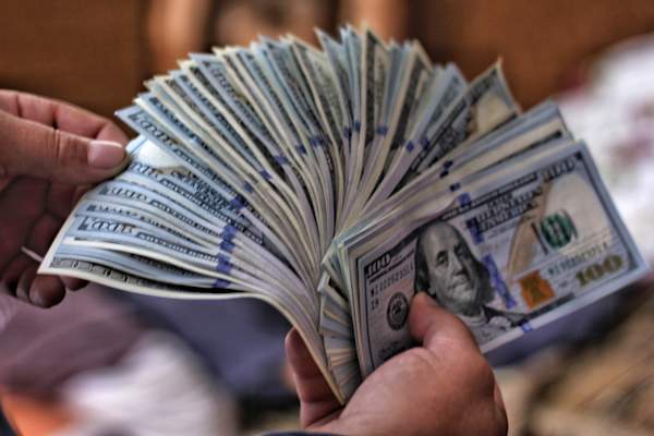 man fanning money