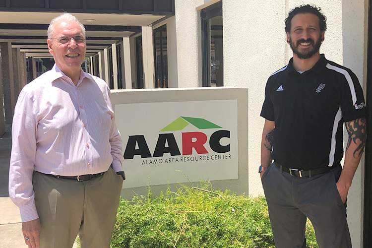 Howard Rogers M.A., and Jacob Castrejana in front of the Alamo Area Resource Center (AARC) HIV/AIDS services agency in San Antonio.