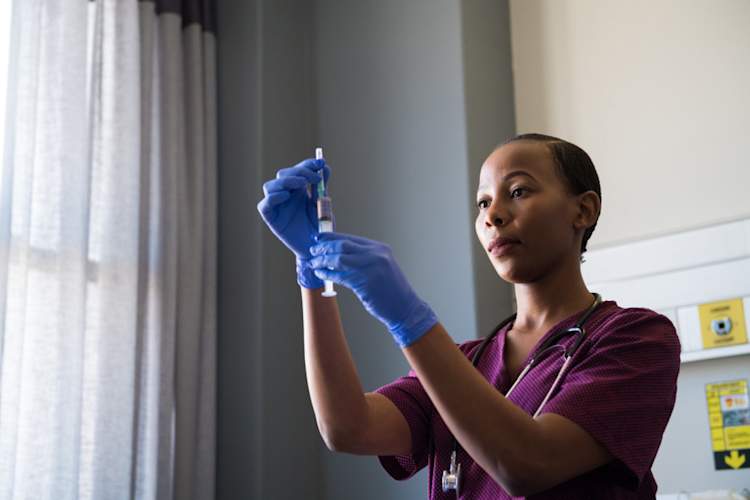 nurse preparing vaccine