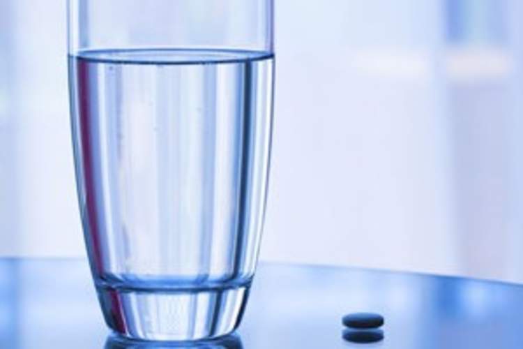 PrEP pill and glass of water
