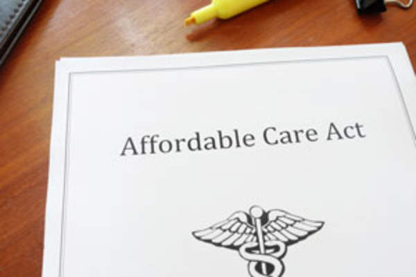Affordable Care Act cover page on desk
