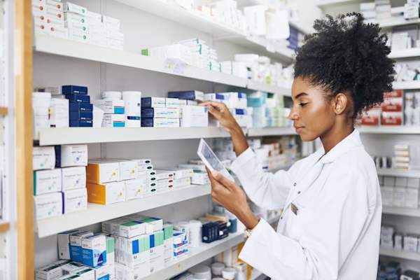 pharmacist looking at tablet