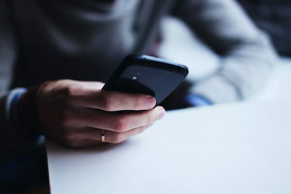 woman's hand using phone