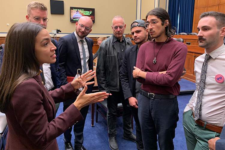 Alexandria Ocasio-Cortez speaks with members of the PrEP4All advocacy group