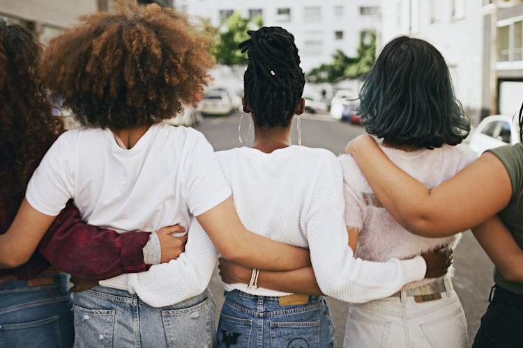 women arm-in-arm