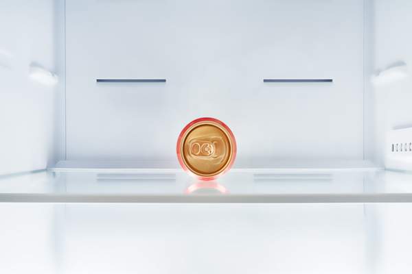 empty refrigerator with single can inside