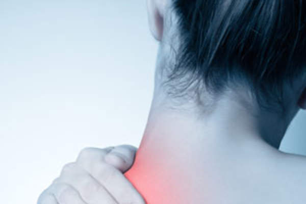 Woman rubbing painful neck