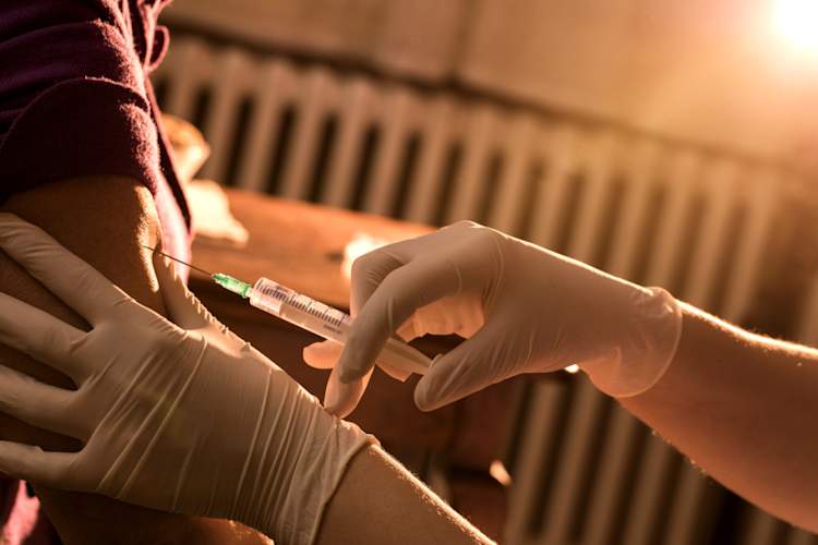 man getting vaccine