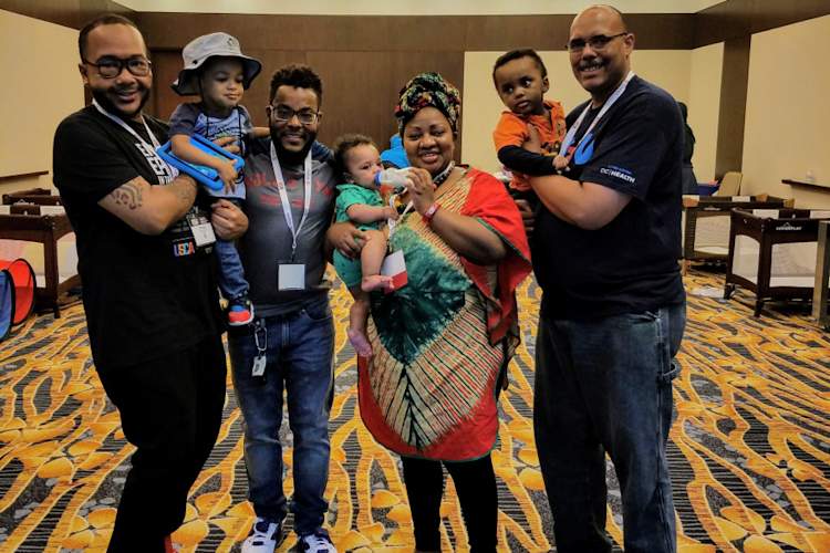 L to R: Charles Shazor, London Shazor, Gavin Shazor, Aaron Anderson Jr.; Claire Gasamagera, Calvin Anderson, and Aaron Anderson Sr.
