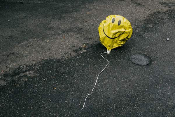 wilted smiley face balloon