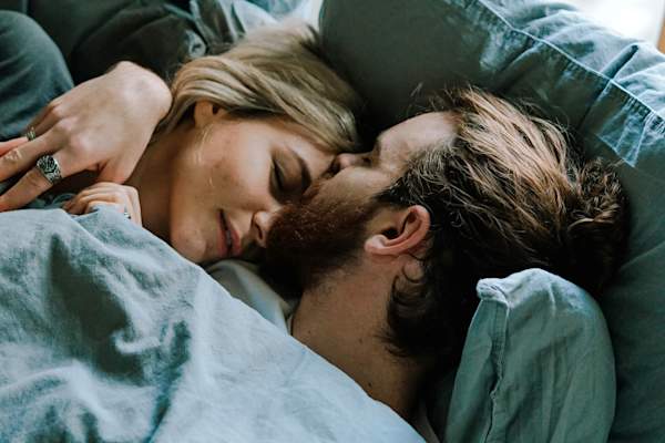 heterosexual couple in bed