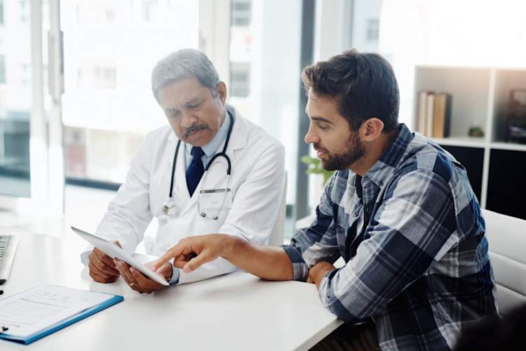 man talking to doctor