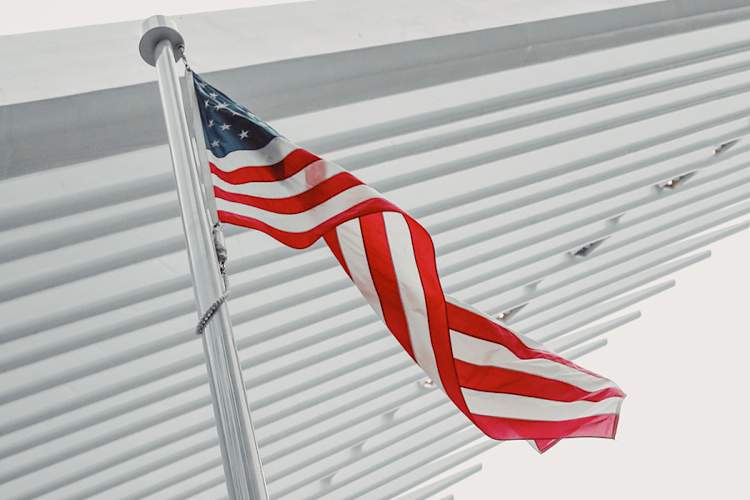 american flag blowing in the wind
