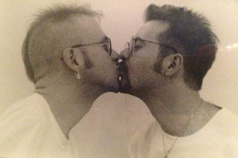 Peter Stinner kissing his husband Jeff Graham