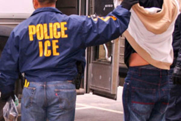ICE officer with immigrant