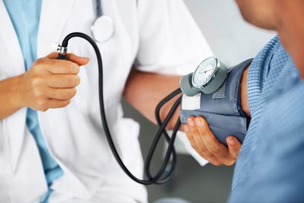 person getting blood pressure tested