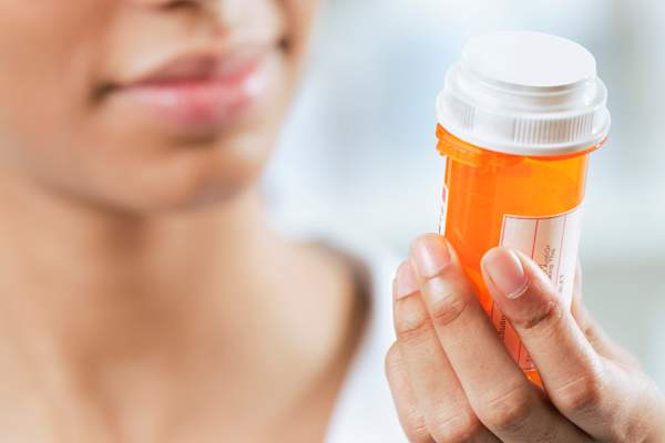 woman with prescription bottle