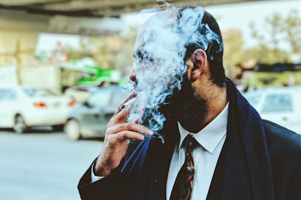 business man smoking cigarette