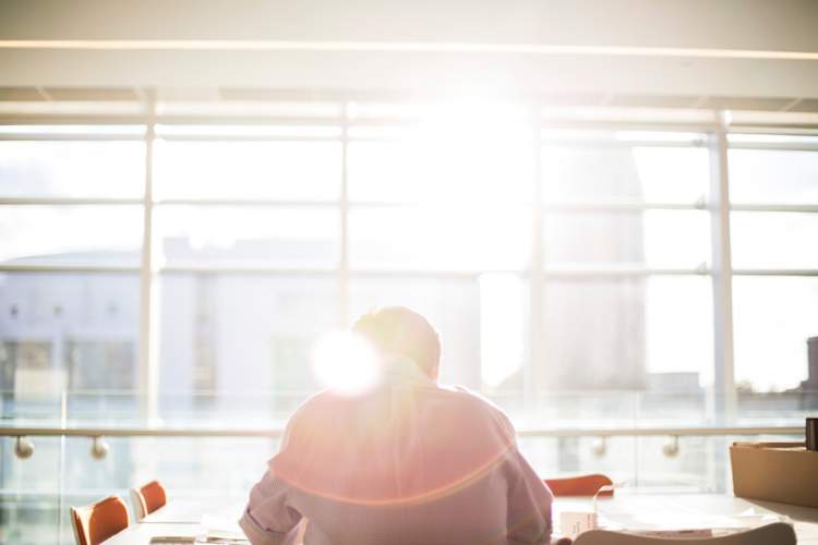 man working alone in office