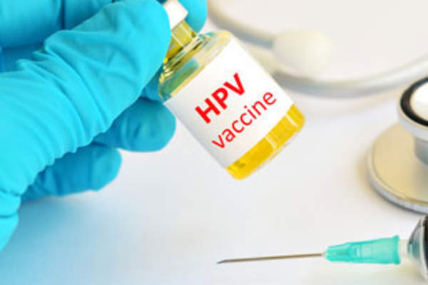 A vial labeled HPV Vaccine