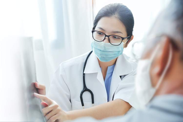 doctor talking to patient masked