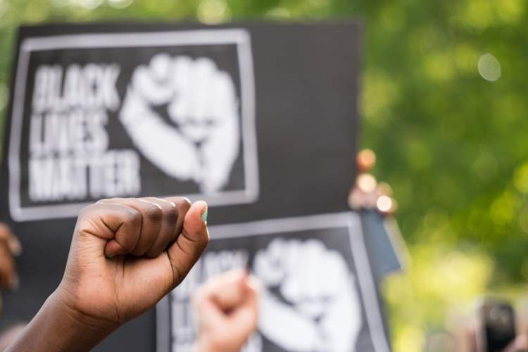 Fist raised at Black Lives Matter Protest