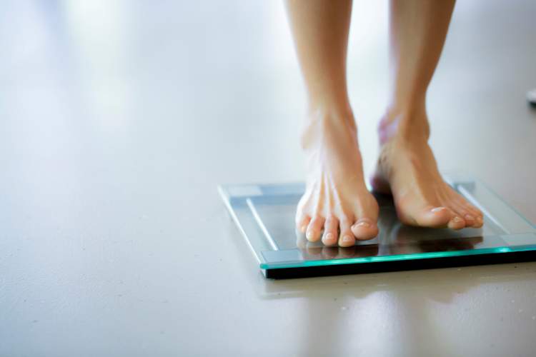 woman's feet on scale