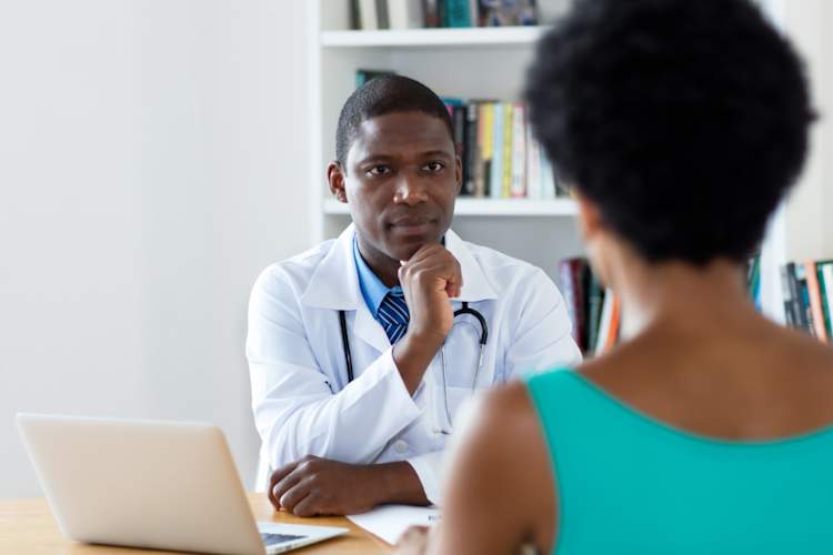 doctor talking to patient
