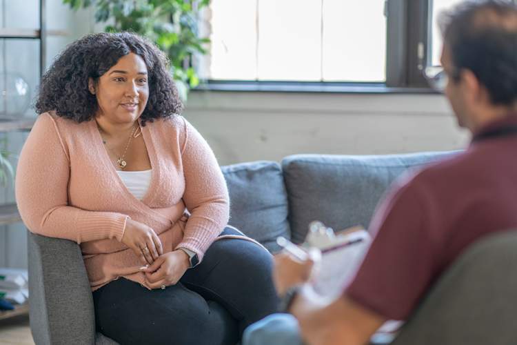 Woman speaking to a mental health counselor