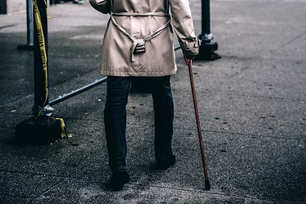 man walking with cane