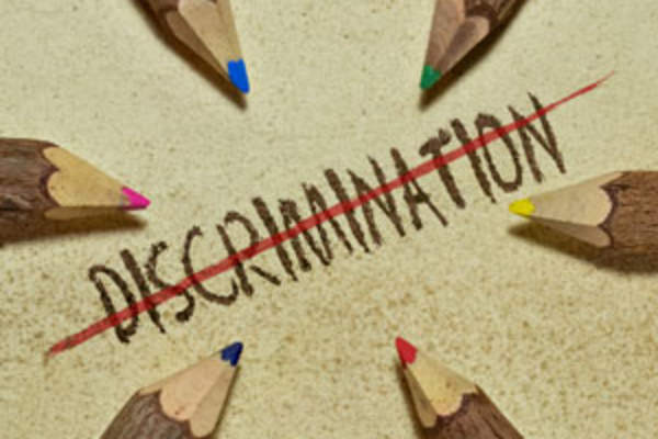 Pencils and the word discrimination crossed out