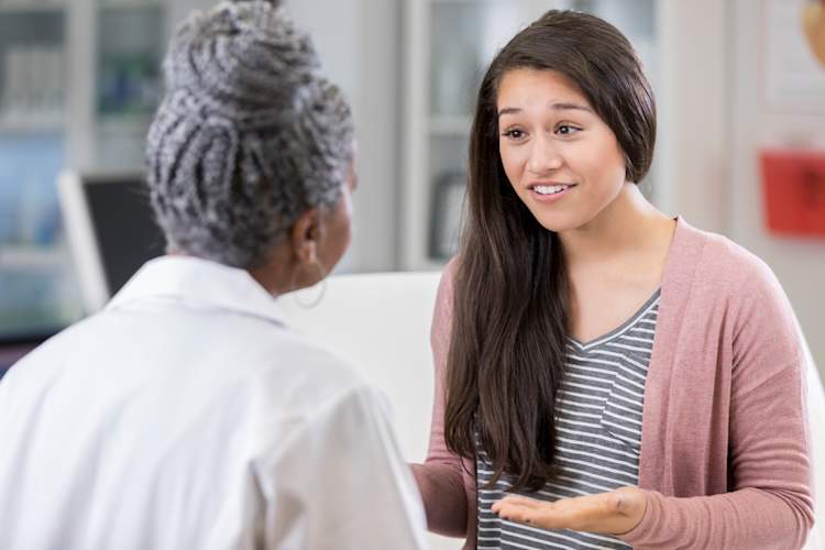 Teenager asking a doctor questions.