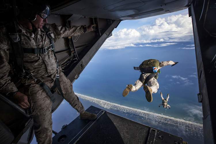 airmen jumping out of US Airforce plane