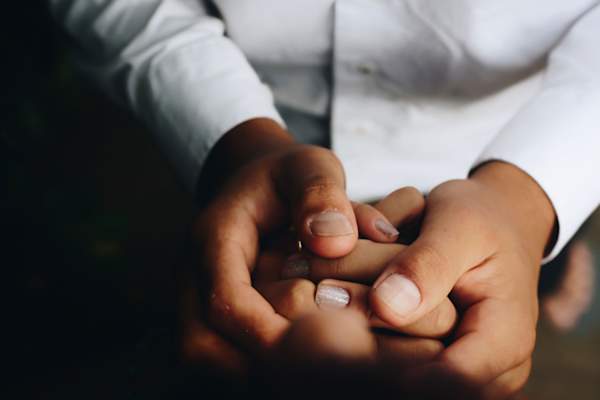 doctor holding patient's hands