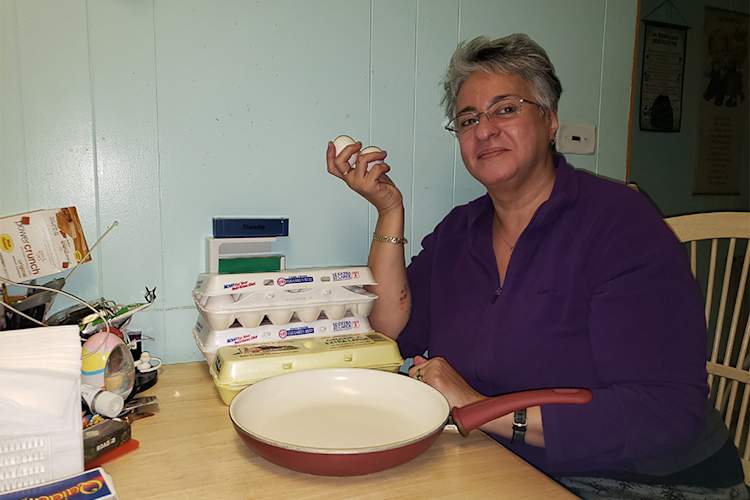 Xio Mora Lopez in kitchen.