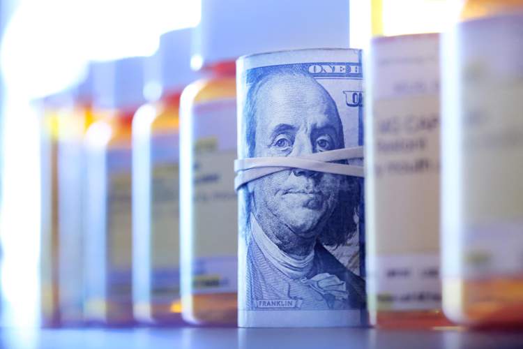 pill bottles and cash