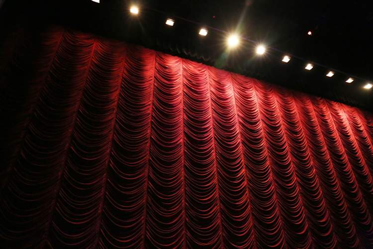 red curtain and lights in theater