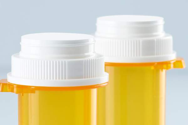 two pill bottle tops