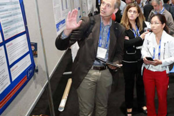 Attendees discuss a poster presentation at IDWeek 2017