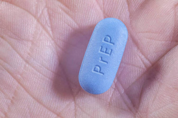 PrEP pill in hand